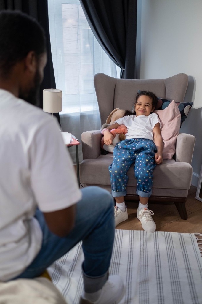 Caregiver connecting with a smiling child