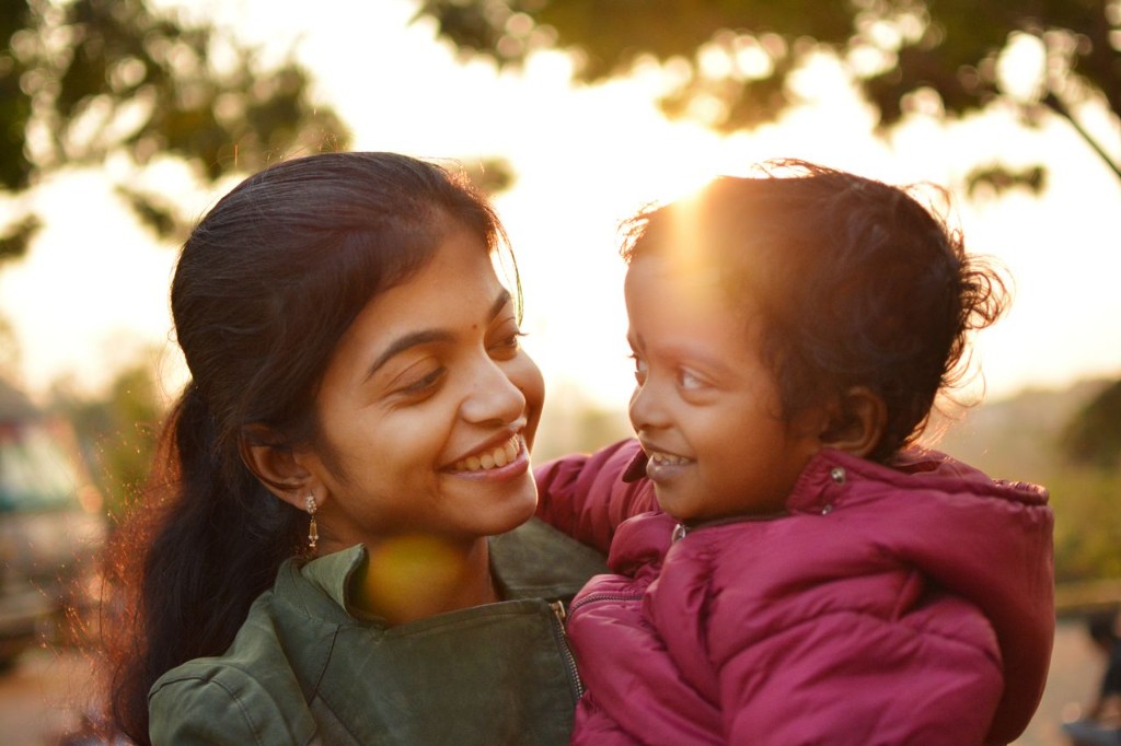 Parent and child sharing a warm outdoor moment